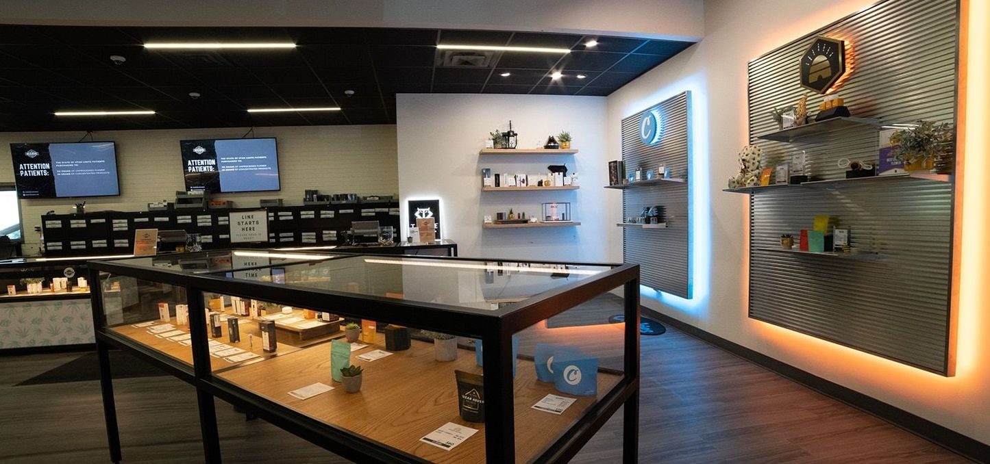 Interior of Beehive Farmacy cannabis dispensary with glass display cases and product shelves
